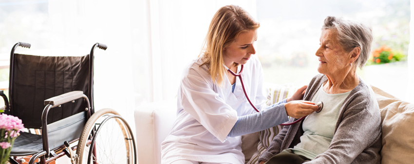 Home health nurse with a senior patient